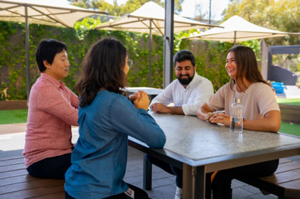 Students sitting around table